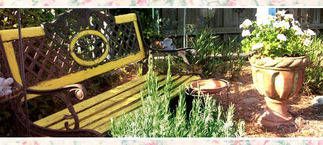 GardenBenchFleaMarketStyle2 Bright paint on an old bench warms a corner of a colorful garden