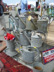 Watering cans wait for new owners