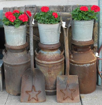 Daphne Ross shows a different way to stack pots,...on vintage milk cans! She says, "Red & Rust!"
