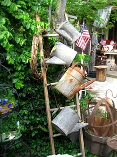 Laura Goines found a cute way to hang her watering cans